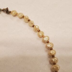 Vintage baroque pearl (5mm x 7mm) necklace with beads dividing the pearls ~17"
